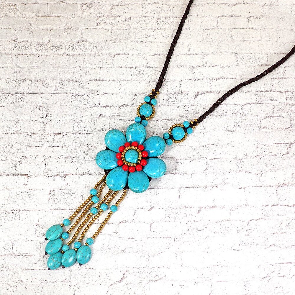 Large turquoise stone beaded flower necklace with a stone tassel fabric cord